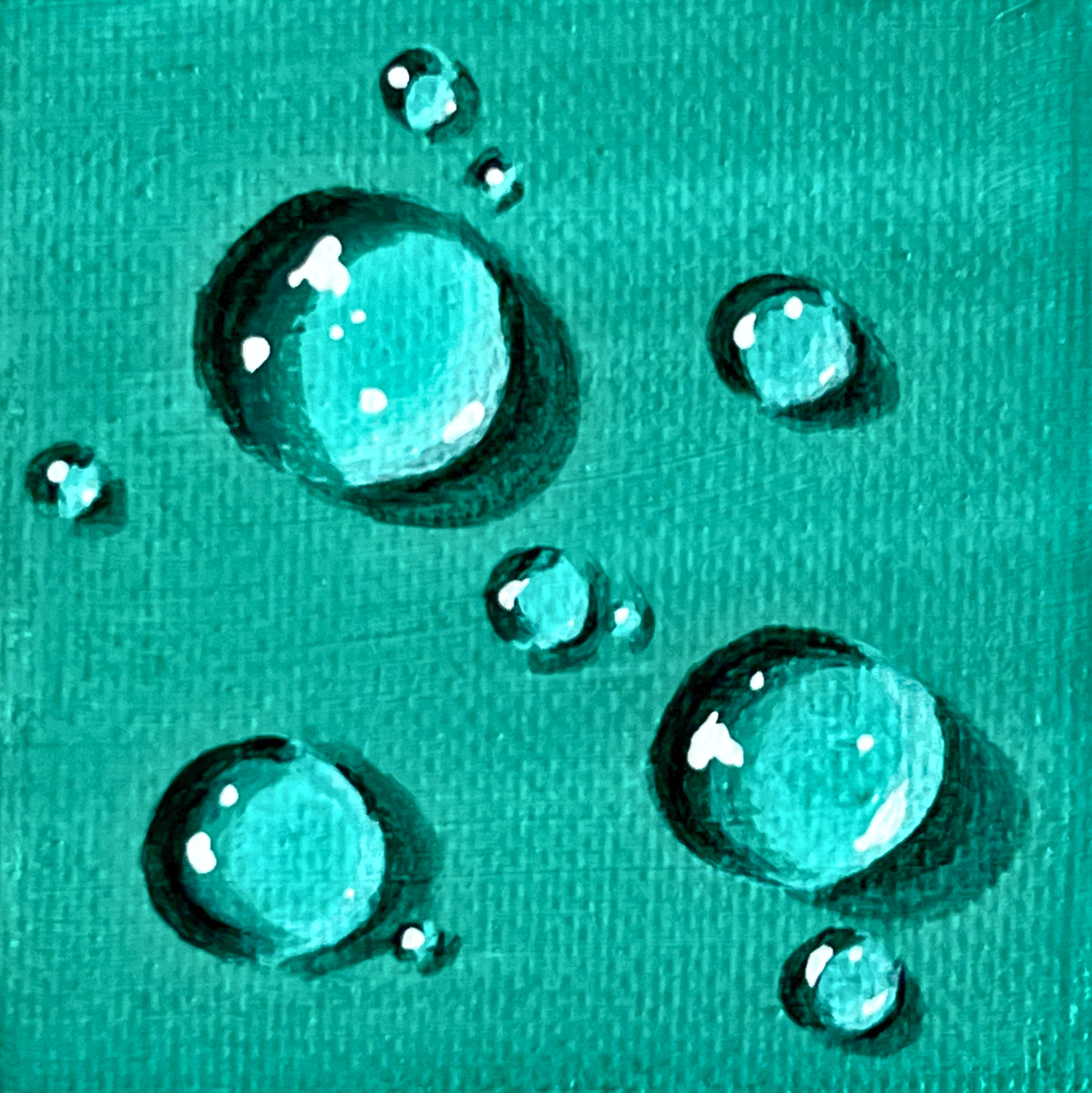 Water droplets against a teal background