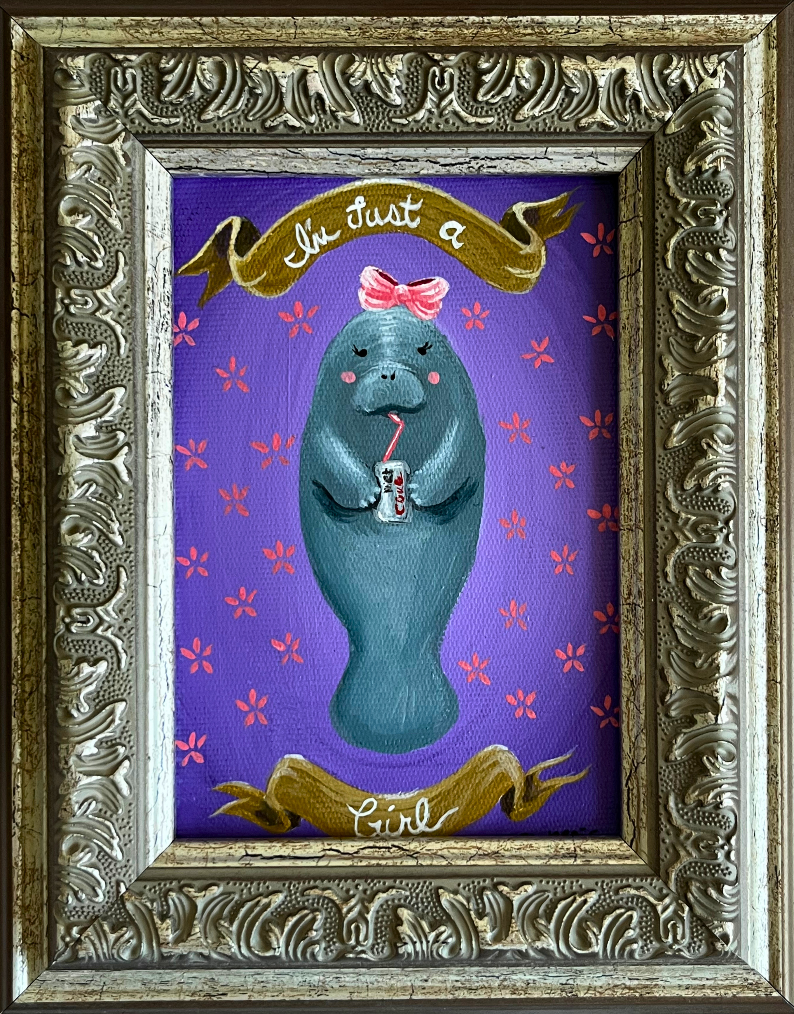 Manatee with pink bow sipping soda