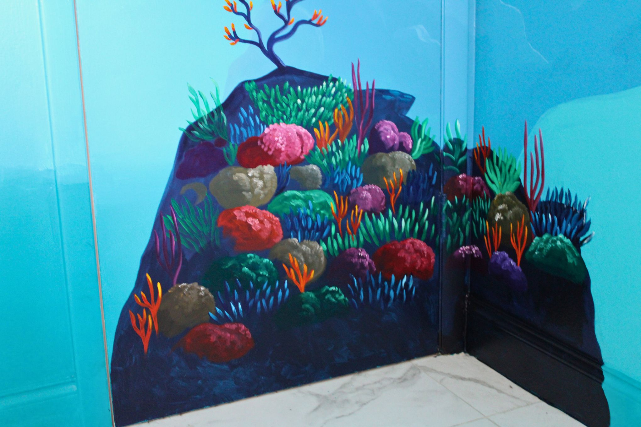Rocky mound with corals and seagrasses on bedroom door